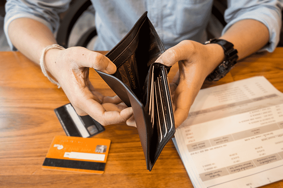 A Man Holds an Open Wallet